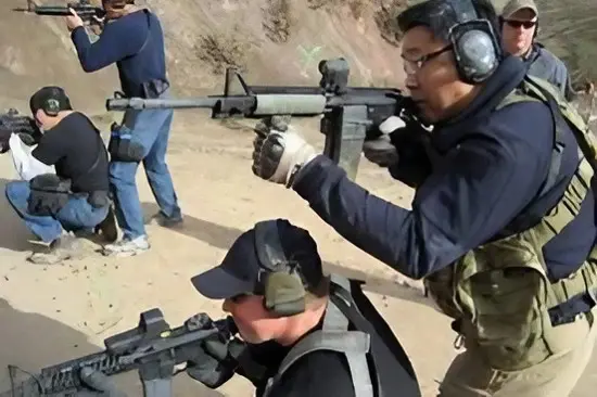 A group of people with guns and helmets.