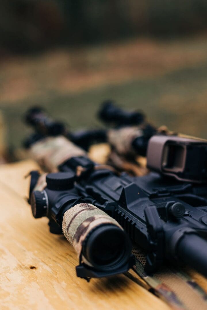 A rifle with two different types of optics on it.