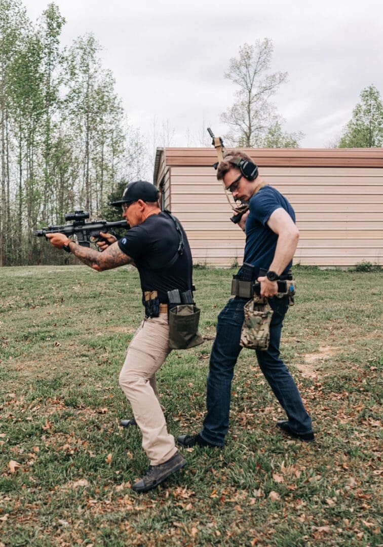 Two men are practicing shooting at a target.