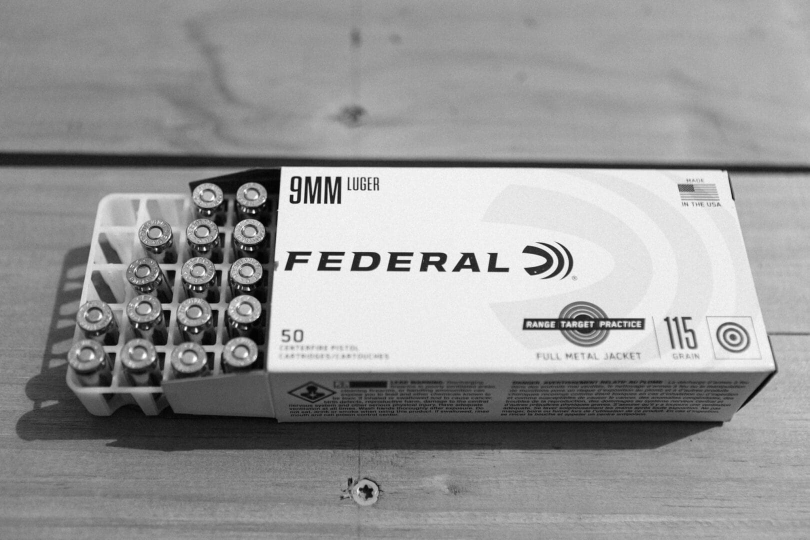 A box of 9 mm ammunition is sitting on the table.