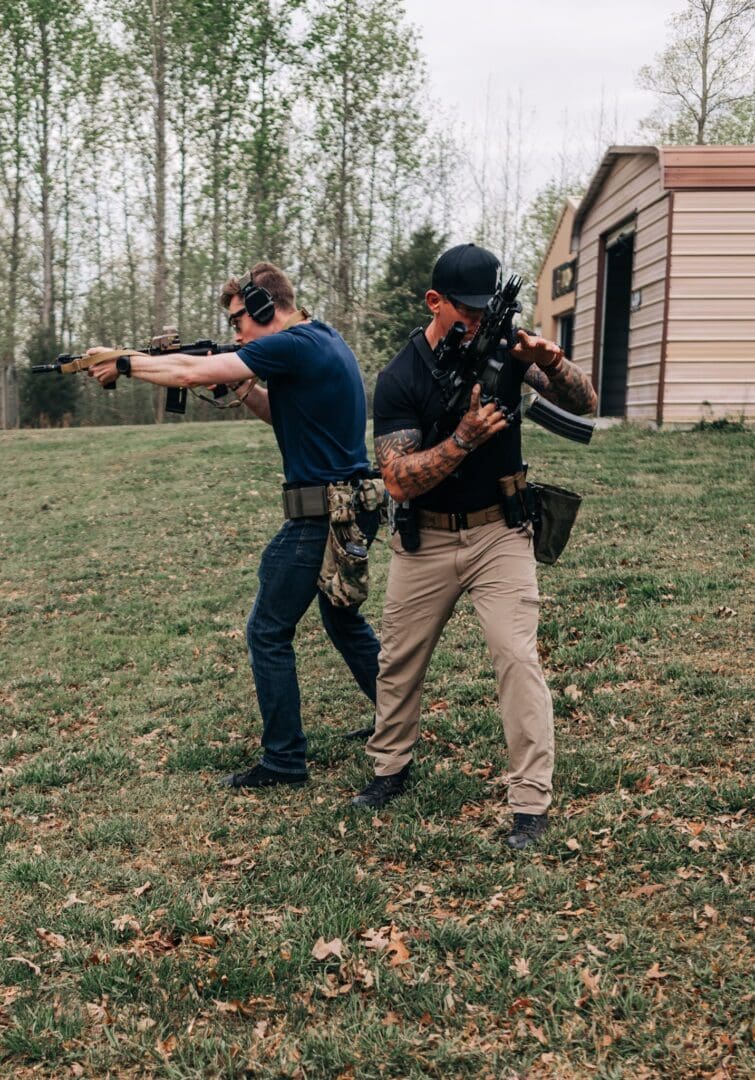 Two men are practicing shooting at a target.