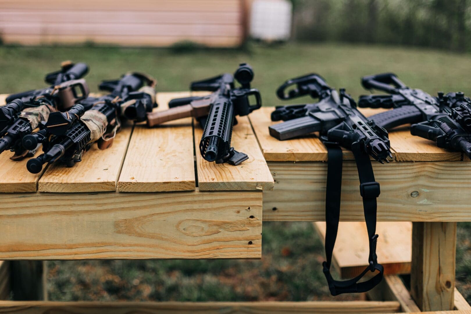 A table with many guns on it